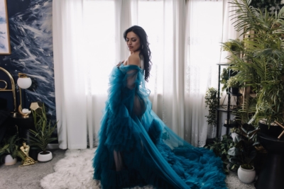 beautiful brunette wearing blue tulle gown