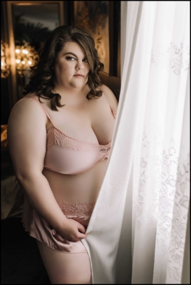 Gorgeous brunette in blush pink two piece lingerie.