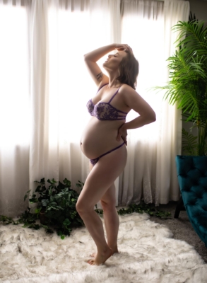 Pregnant Woman Silhouette In Front Of Window In Lingerie