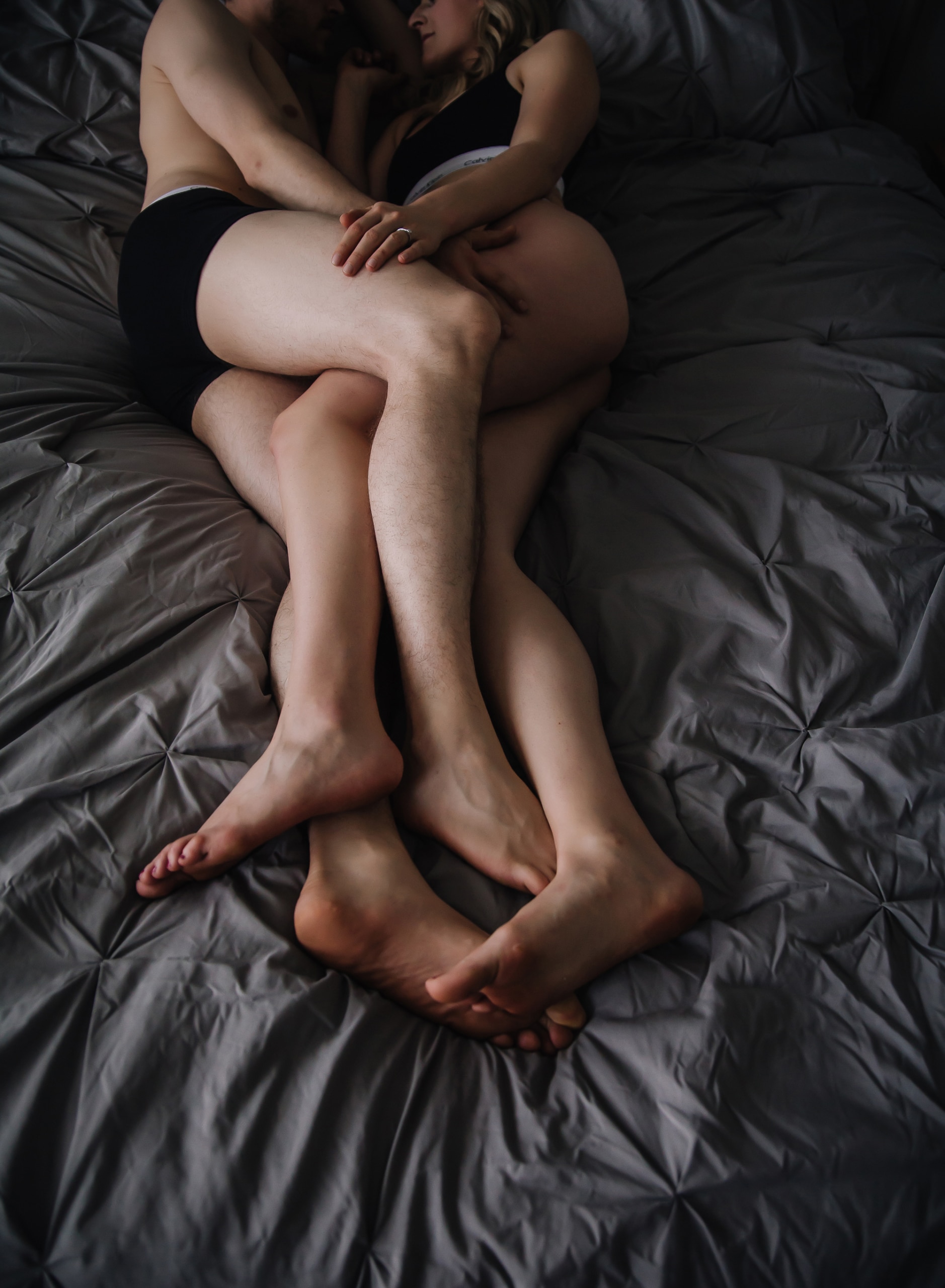 couples-legs-snuggled-bed