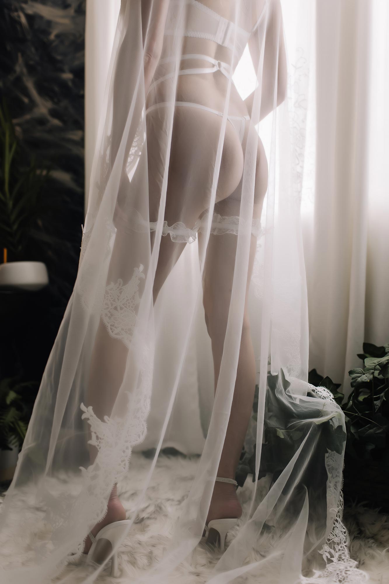 woman wearing bridal lingerie and veil woman wearing bridal lingerie and veil